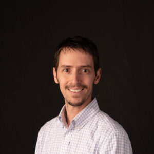 Portrait of Jeff Wilson, wearing polo, with a smile